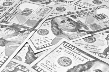 Wall Mural - american paper money. 100 dollar and other us bills. black and white light background or wallpaper. 