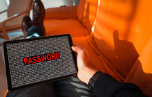 Man Holding A Tablet With The Word Password On Screen.
