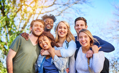 Poster - Our favourite time of college, hanging with the crew. Portrait of a group of diverse students hanging out together outside on campus.