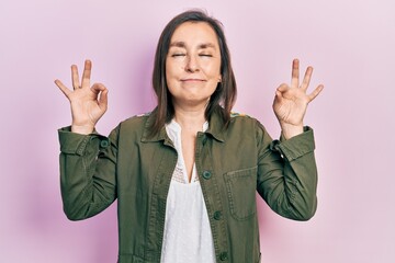 Canvas Print - Middle age hispanic woman wearing casual clothes relax and smiling with eyes closed doing meditation gesture with fingers. yoga concept.