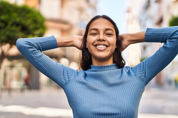 Poster - Young african american woman smiling confident standing with hands on head at street