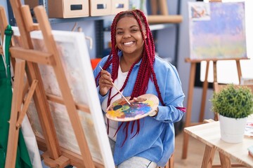 African american woman artist smiling confident drawing at art studio