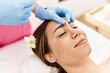 © Krakenimages.com - Young hispanic woman having anti-aging treatment at beauty center.