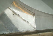 Close Up On Metal Panels On The Fuselage Of An Aircraft Near Tail Section. Suitable For Background For Graphics And Text