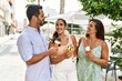 © Krakenimages.com - Three hispanic friends smiling happy eating ice cream at the city.