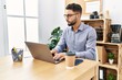 © Krakenimages.com - Young arab man using laptop working at office