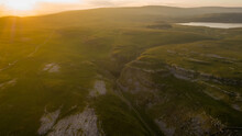 Aerial Sunset Of Comb Hill And Watlows Dry Valley Part Of The Limestone Landscape Near Malham Cove, Malham, North Yorkshire, UK