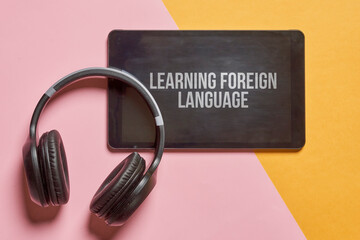 Wall Mural - e-learning or online education concept. webinar, internet lesson or courses. headphones, smartphone 