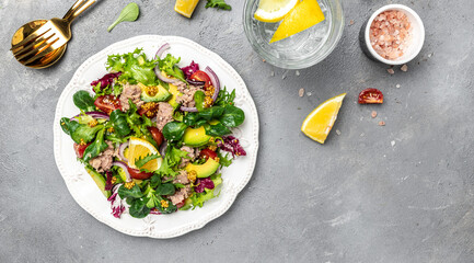 Wall Mural - Tuna salad with lettuce, cherry tomatoes, avocado and red onions. Delicious breakfast or snack, Clean eating, dieting, vegan food concept. top view