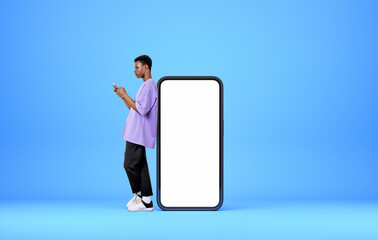 Poster - Black man using phone, mockup screen copy space on blue background