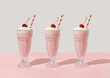 Leinwandbild Motiv Retro romantic creative pattern with strawberry milkshake with cherry on top on white and pastel pink background. 70s, 80s or 90s retro fashion aesthetic idea. Valentines day romantic idea.