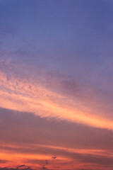 Wall Mural - glowing clouds on the red sky in evening light. dramatic weather in summer at dusk