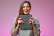 Happy woman teacher or student girl holding book in front of, isolated female portrait.