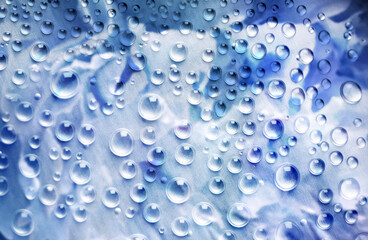 Wall Mural - abstract background in blue and green colors with glass and drops of water