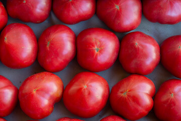 Wall Mural - Red tomatoes top view in the store. Pattern, background