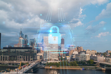 Aerial panorama city view of Philadelphia financial downtown at day time, Pennsylvania, USA. Glowing Padlock hologram. The concept of cyber security to protect companies confidential information