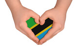 Fototapeta Tęcza - Kid's hands in heart- form. National peace concept on white background. Tanzania