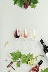 Canvas Print - Flat-lay of red, rose and white wine in glasses on white background