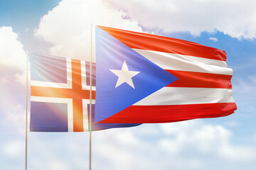 Sunny blue sky and flags of puerto rico and iceland