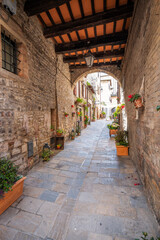 Wall Mural - View of an old city centre street of Gubbio (Umbria Region, central Italy). Is world famous as one of the city were lived St. Francis (Christian Italy’s Saint Patron).