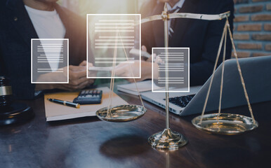 Justice and law concept.Male judge in a courtroom with the gavel, working with, computer and docking keyboard, eyeglasses, on table in morning light