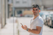 © carballo - man with mobile phone on the street