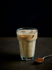 Wall Mural - Glass of iced coffee with milk. Copy space