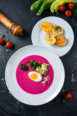 Wall Mural - Vegan food, summer cold Beetroot soup with fresh herbs copy space top view