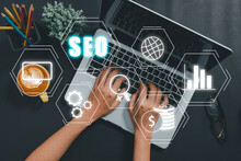 SEO Concept, Search Engine Optimization, Woman Hand Using Laptop Computer With VR Screen Seo Icon, Concept For Promoting Ranking Traffic On Website, Optimizing Your Website To Rank In Search Engines.