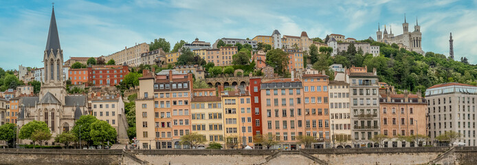 Wall Mural - Colorful houses of Vieux Lyon on the River Saône quayside, overlooked by Renaissance-era mansions withmedieval Cathédrale Saint-Jean-Baptiste