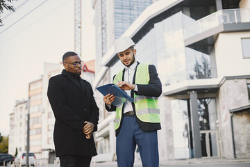 Property developer and black man discussing future flat