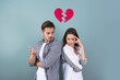 © New Africa - Upset young couple and illustration of broken heart on color background. Relationship problems