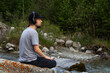 © Chepko Danil - Young man in headphones listening music in nature and at the mountain