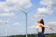 © Antonioguillem - Excited woman screaming in a wind farm
