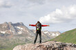 © Antonioguillem - Hiker celebrating success in the top of a mountain