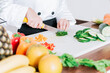 © IHERPHOTO - Chef hands preparing and cutting vegetables, Close up of a woman chef cutting vegetables, Hands of female chef cutting vegetables