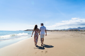 Wall Mural - Happy young couple at the sea vacations