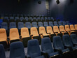 © artmim - Empty row line of blue and orange seats in the cinema hall