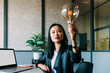 © Westend61 - Businesswoman analyzing light bulb at office