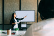 © Westend61 - Mature businesswoman giving presentation to colleague at office