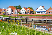 Germany, Lower Saxony, Greetsiel, Town Harbor In Spring With Houses In Background
