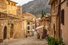 View Of Church Clock Tower And Street In The Old Town Of Pollenca, Pollenca, Majorca, Balearic Islands