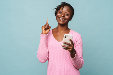 Wall Mural - African american happy woman gesturing and holding cellphone