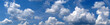 Leinwandbild Motiv Blue sky with small clouds - panorama