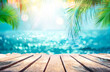 Summer Table And Sea With  Blurred Leaves Palm And Defocused Bokeh Light On Ocean - Wooden Plank In Abstract Landscape