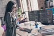 © deagreez - Profile side view portrait of attractive girl web developer using gadget app writing code task issue at workplace workstation indoors