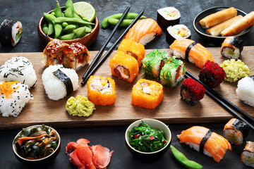 Japanese food assortment on dark background.