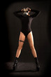 © evgenzz - Sexy girl fetish model with a slim figure poses standing in a black gas mask, black sexy bodysuit and high stripper heels. BDSM, perversion, fetish, radioactive or bio-contamination
