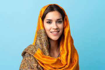 Sticker - Young Moroccan woman with traditional costume isolated on blue background