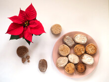 Plate With Traditional Spanish Sweets Polvorones Y Mantecados, Flower Poinsettia Christmas Star. Flat Lay